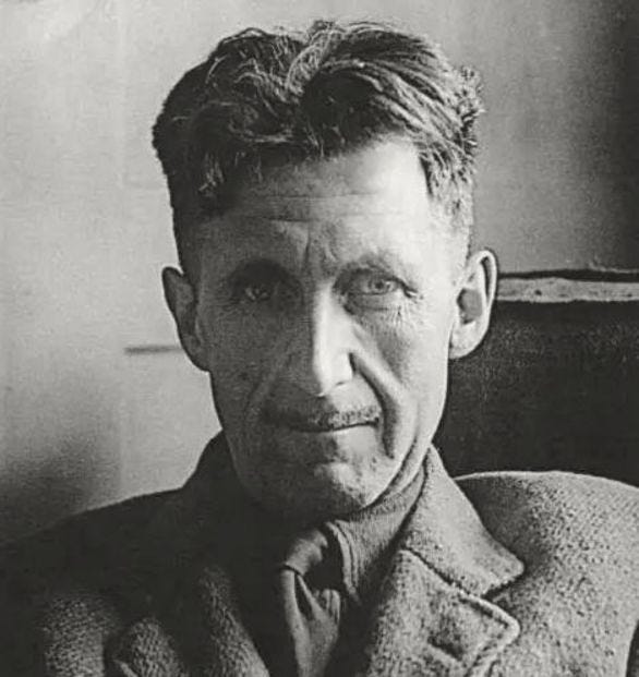 Eric Blair aka George Orwell in his characteristic pencil mustache seated and staring directly into camera