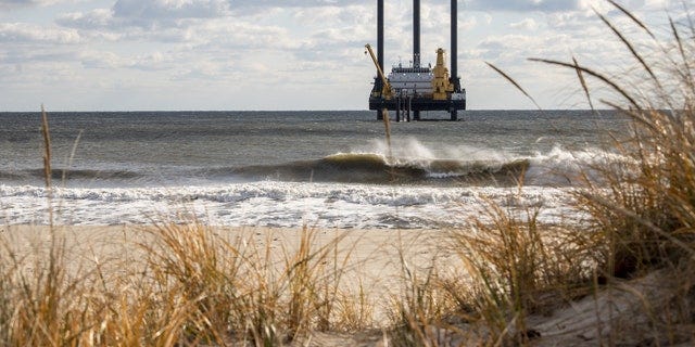 A lift boat is pictured off the beach near Wainscott, New York, on Dec. 1. The vessel's drill will be used in the construction of the South Fork Wind farm that is expected to start generating power in late 2023.
