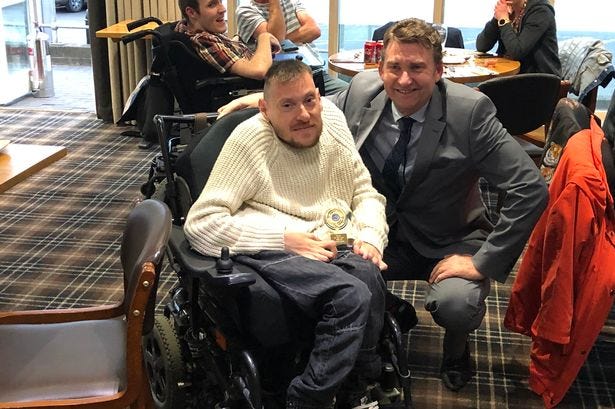 Ayrshire Tigers Captain, James Doull is pictured with Brian Whittle MSP