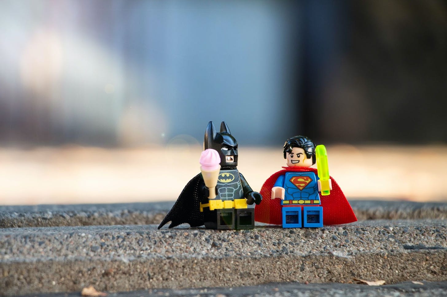 Two superheroes having a snack and going for a walk