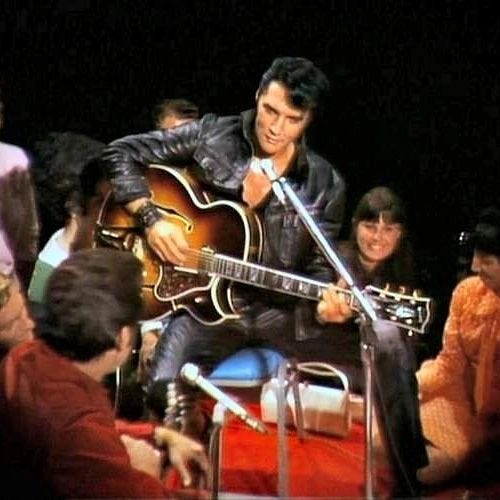 Elvis playing guitar