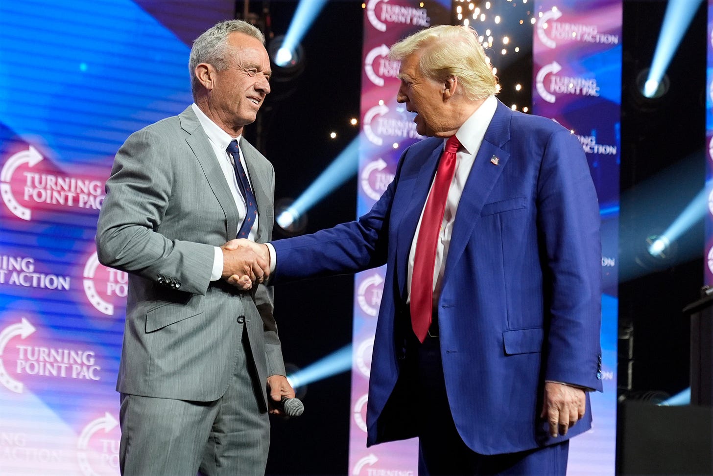 Republican presidential nominee former President Donald Trump greets Robert F. Kennedy Jr., at a Turning Point Action campaign rally last October in Duluth, Georgia