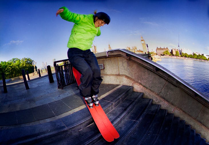 Someone skiing on steps next to the Thames