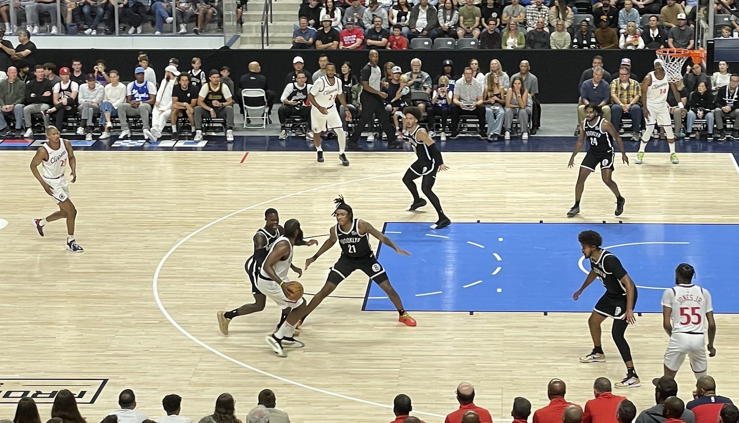 Los Angeles Clippers guard James Harden (with the ball) navigates the Brooklyn Nets’ defense during a preseason game on Monday at Frontwave Arena in Oceanside. Steve Puterski photo