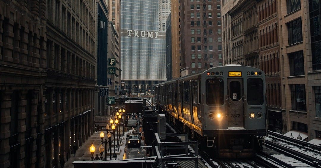 grey train beside buildings