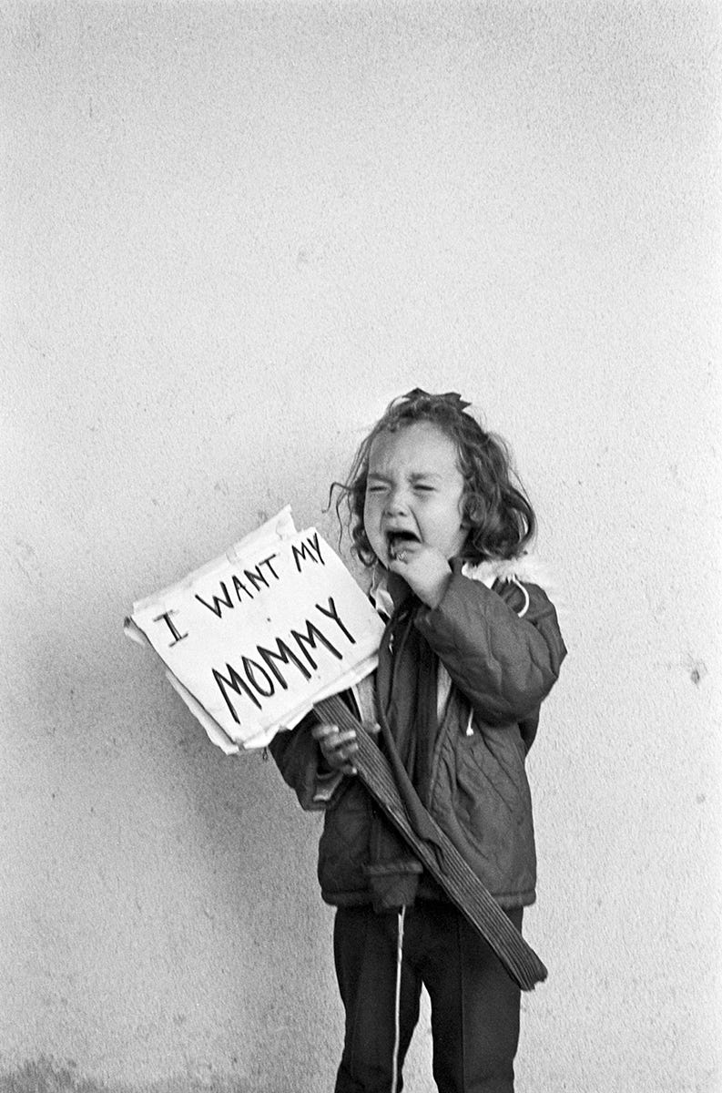 Three-year-old Carmen Ramos Chandler—daughter of Irene Ramos and Bill Chandler who were arrested in Roma, Texas—cries while holding a sign that reads, "I want my mommy." South Texas, 1966. Photo by Emmon Clarke. © Tom and Ethel Bradley Center.