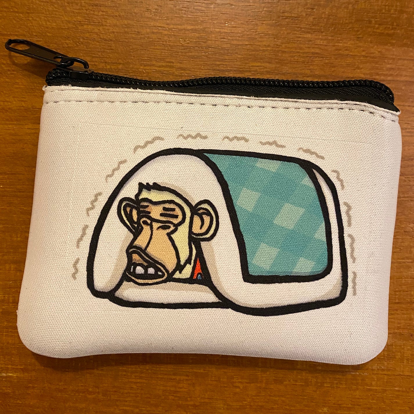 A real wallet, with an ape feeling really cold.