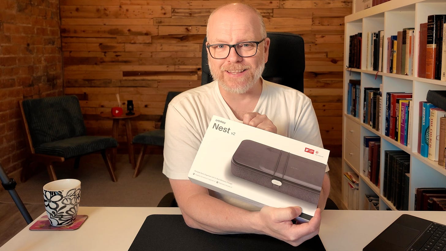 A picture of the author of this article holding the Orbitkey Nest v2 and looking very happy about it