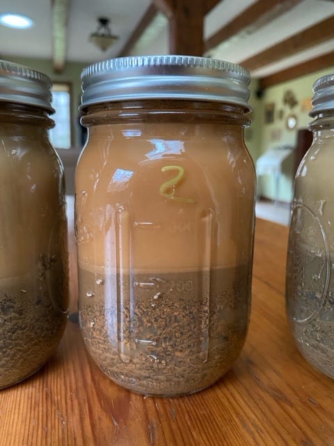 mason jars full of soil samples