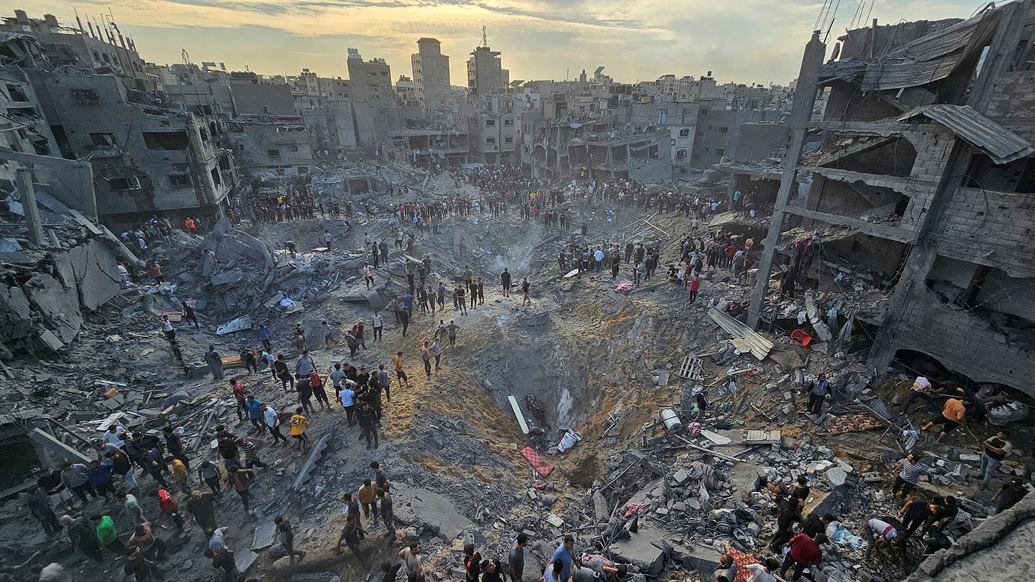 Palestinians search for casualties at the site of Israeli strikes in Jabalya refugee camp in northern Gaza, on October 31.
