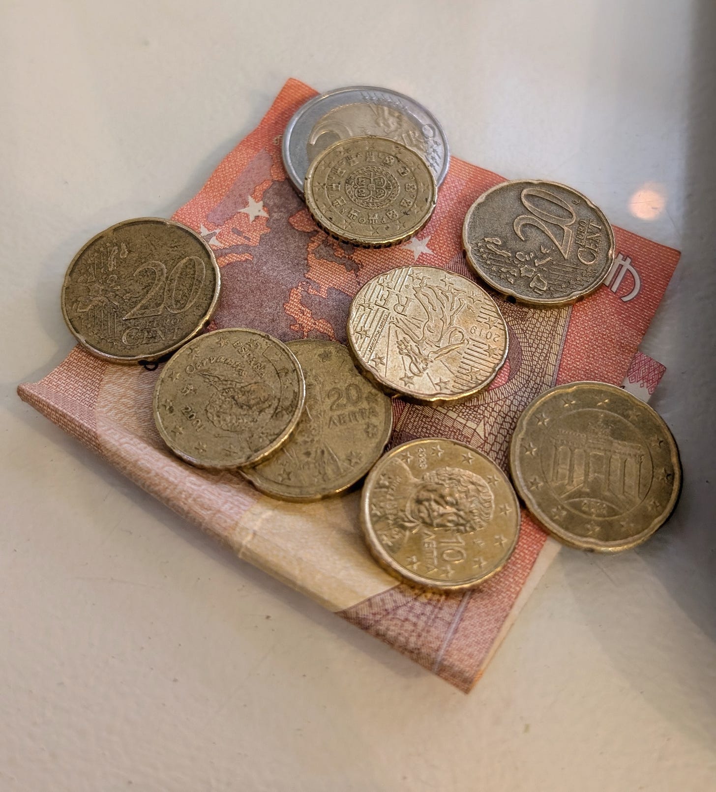 10+ euros in cash on a table