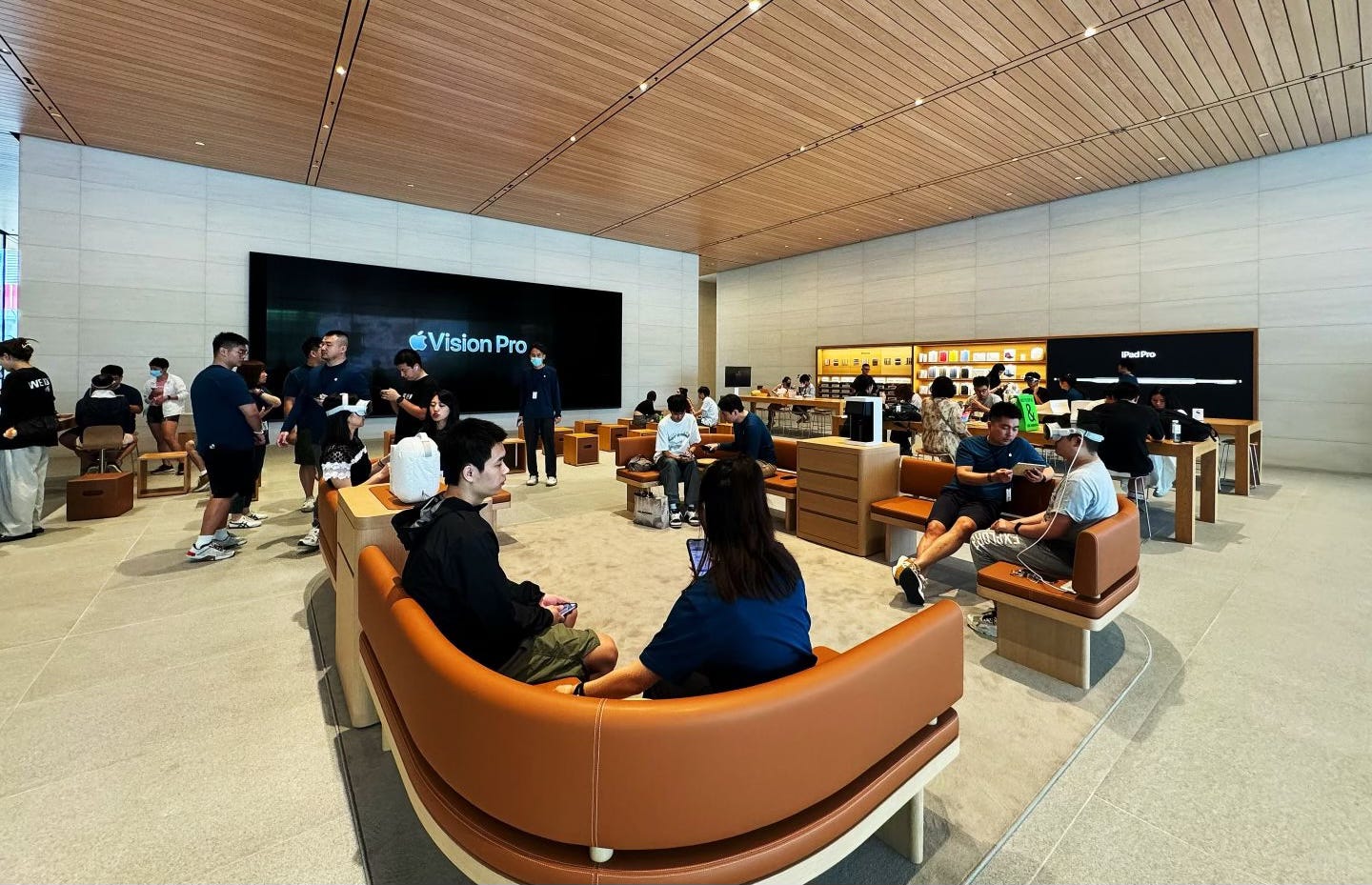 The Demo Zone at Apple Sanlitun. A set of four sofas is near the Forum on the upper level of the store.