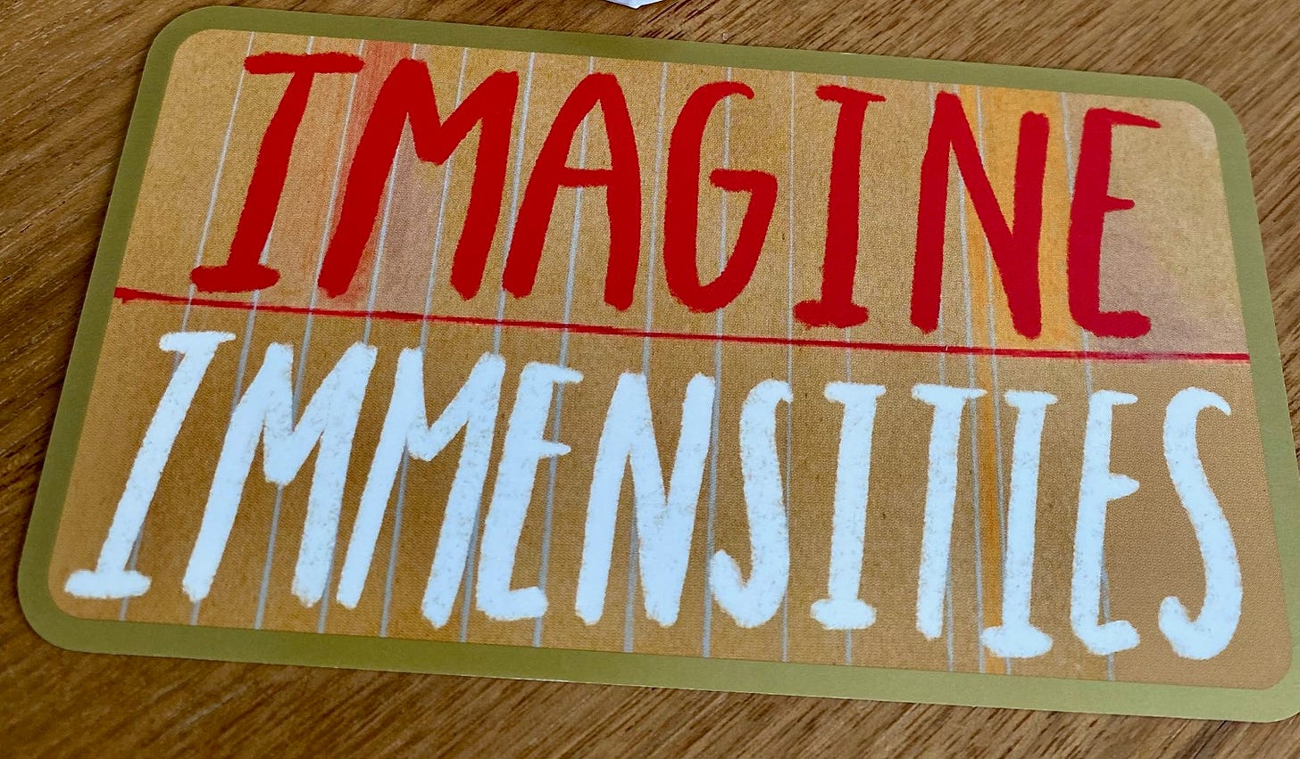 Image of card that reads Imagine Immensities in tall block letters