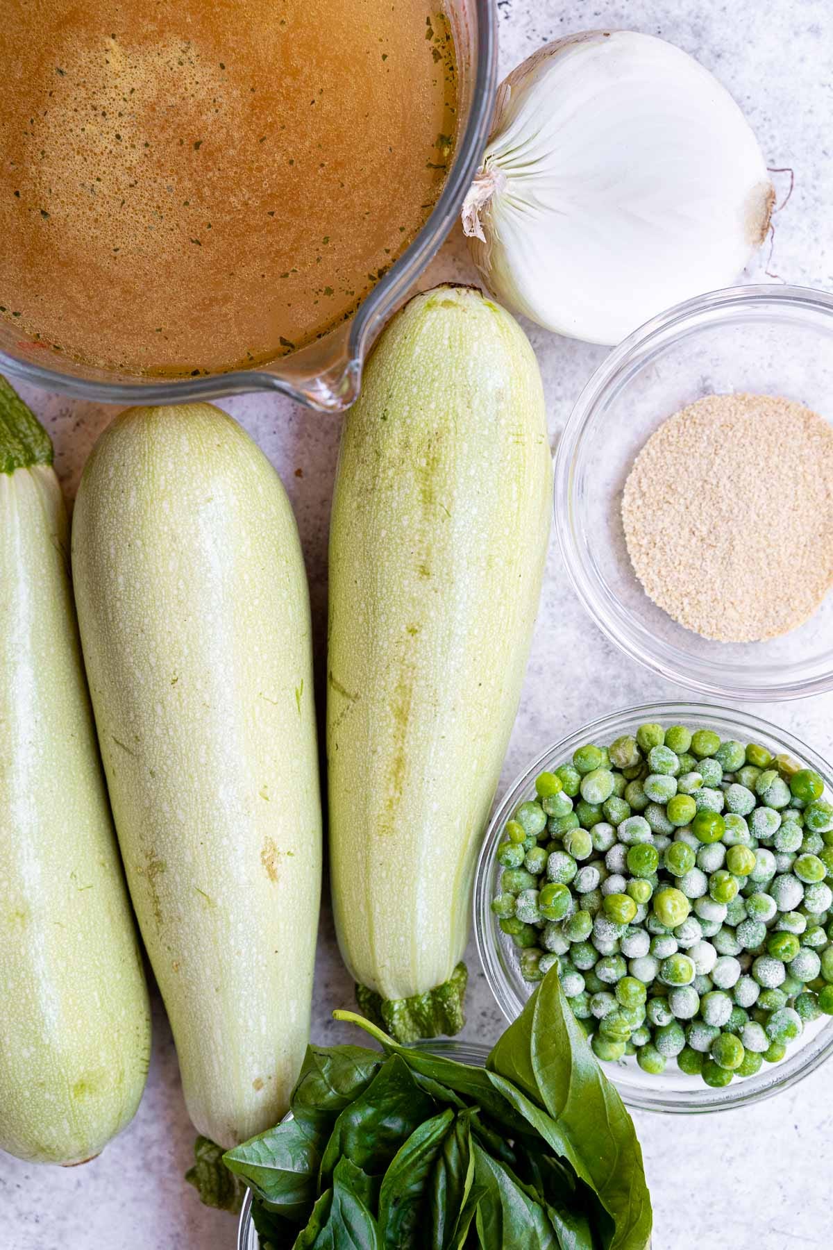 ingredients for zucchini, pea, and basil soup