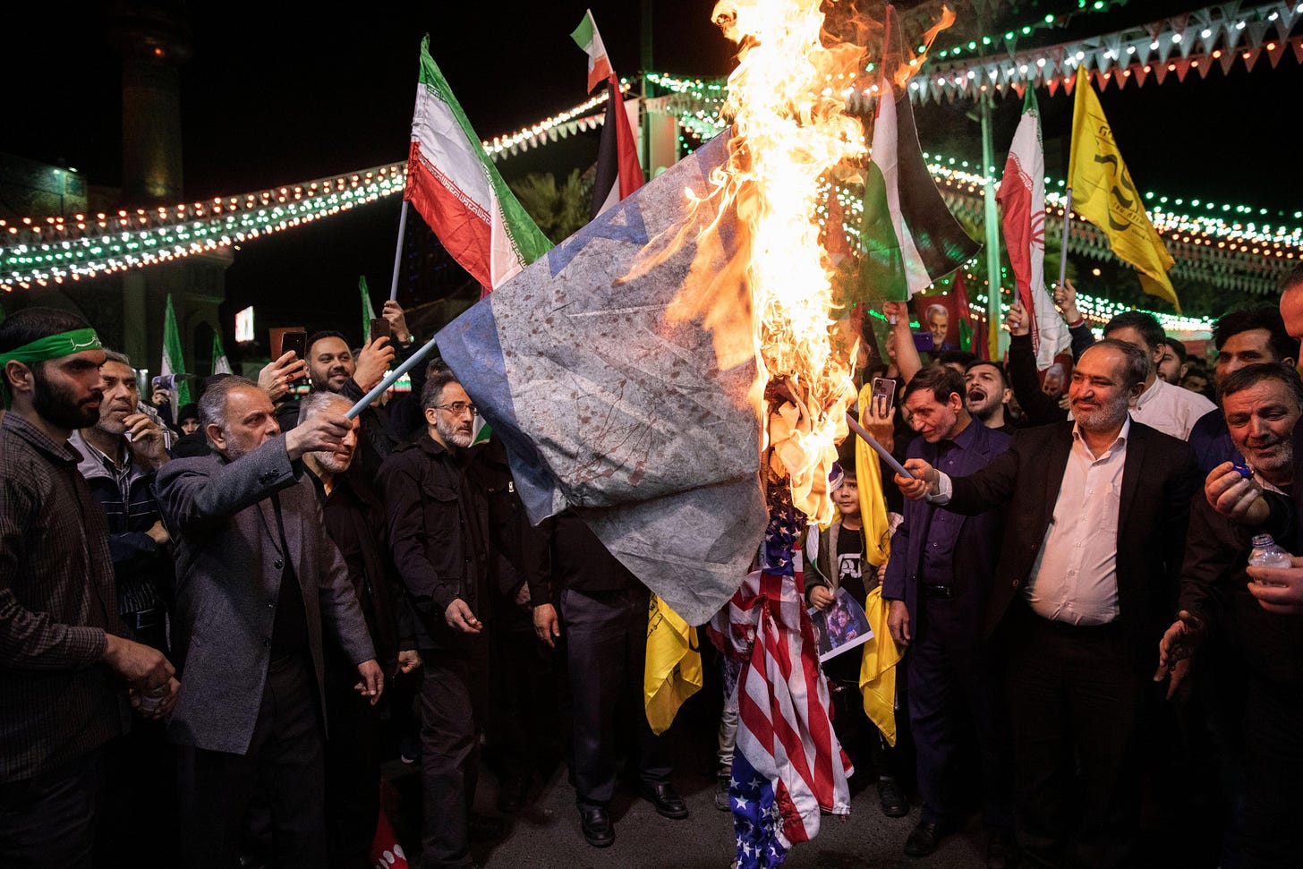 Iranians burning an Israel flag before the attack