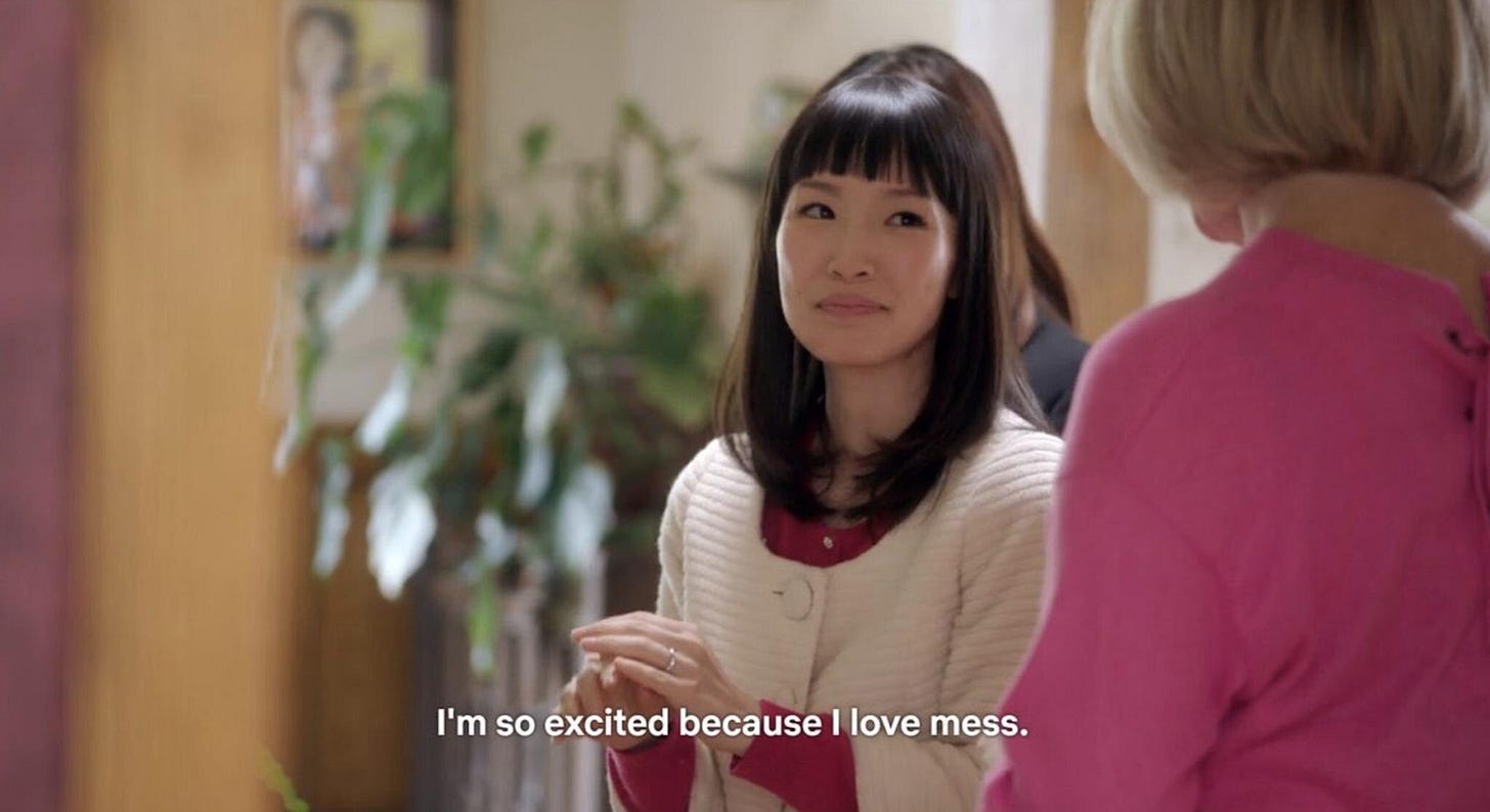 Screencap of Marie Kondo from her show Tidying Up With Marie Kondo. The subtitles read, "I'm so excited because I love mess."