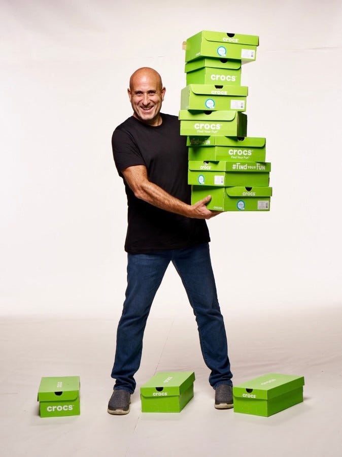 Terence Reilly holding crocs boxes