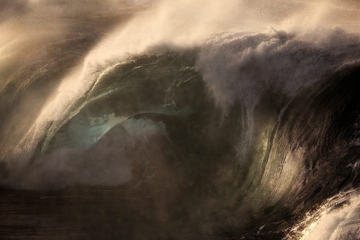 an image of a bareeling wave with the light behind it