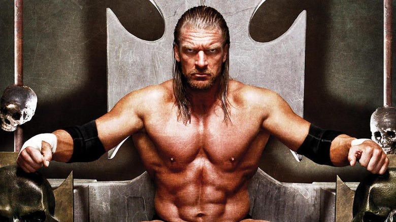 Triple H sits on a throne