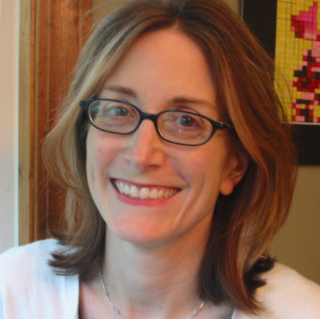 author photo of Christina Consolino, a white woman with shoulder length hair and glasses