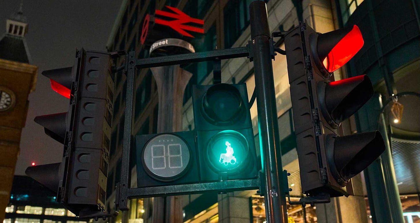 Pedestrian crossing signal with illuminated wheelchair icon.