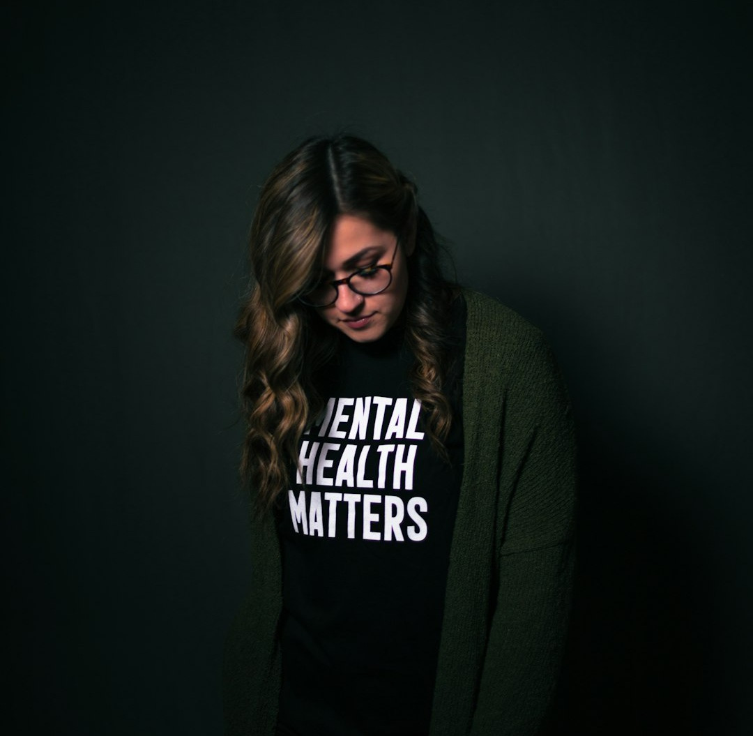 woman in black and white long sleeve shirt woman in black and white long sleeve shirt