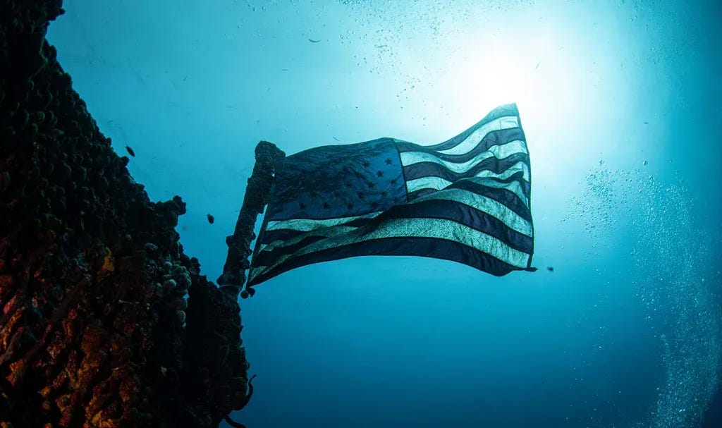 Image of an American flag underwater.