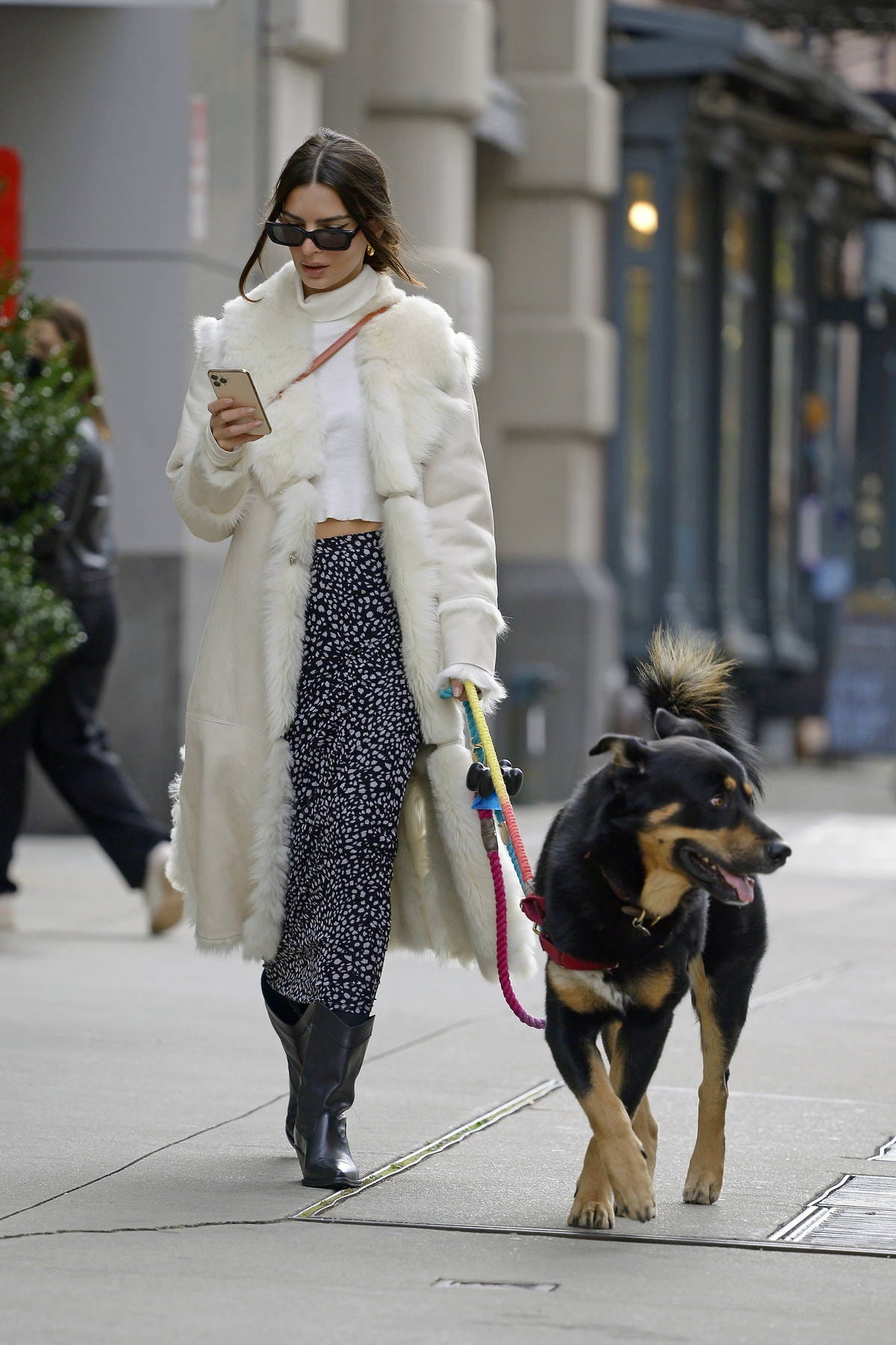 emily ratajkowski looks chic a white fur coat, white top, and patterned  skirt while walking her dog in tribeca in new york city-171121_5