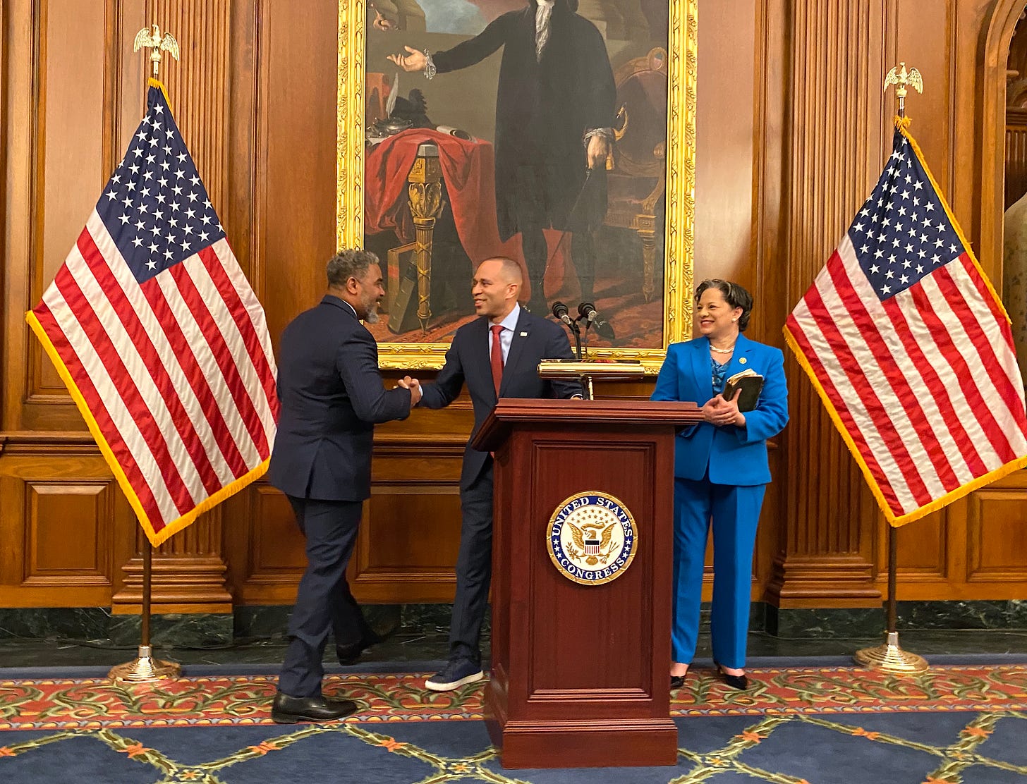 Rep. Steve Horsford shakes hands with Hakeem Jeffries as Rep. Jennifer McClellan looks on