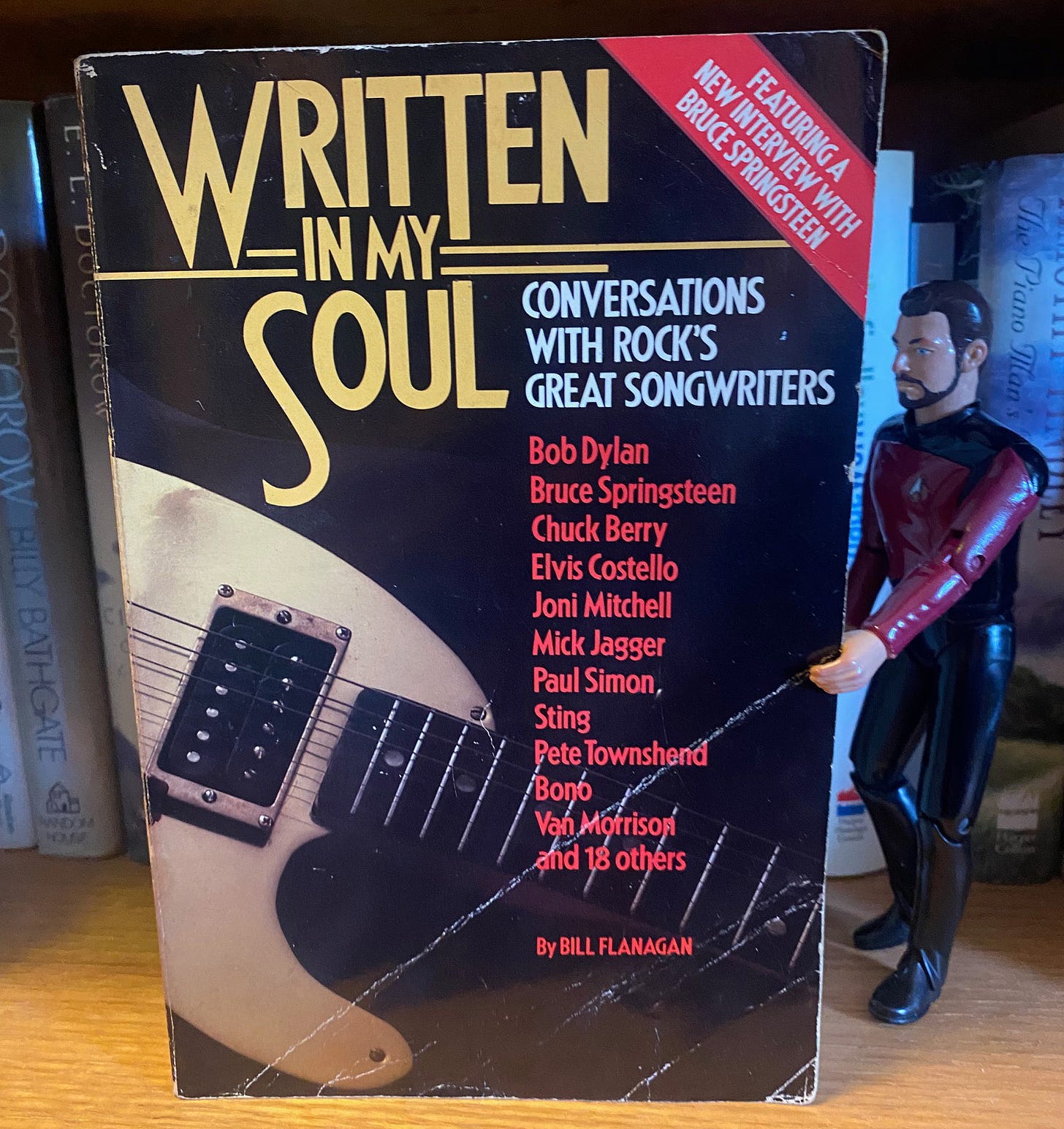 Written in My Soul by Bill Flanagan on my bookshelf with Little Riker