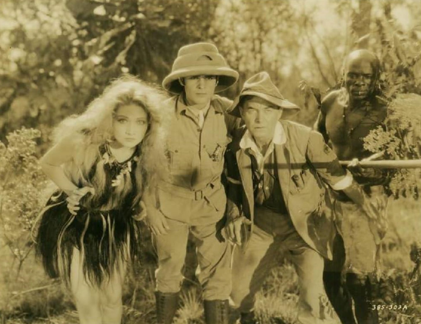 Edwina Booth, Duncan Renaldo, Harry Carey, and Mutia Omoolu in a scene from Trader Horn