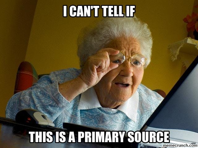 old woman looking underneath her glasses to read her laptop screen better