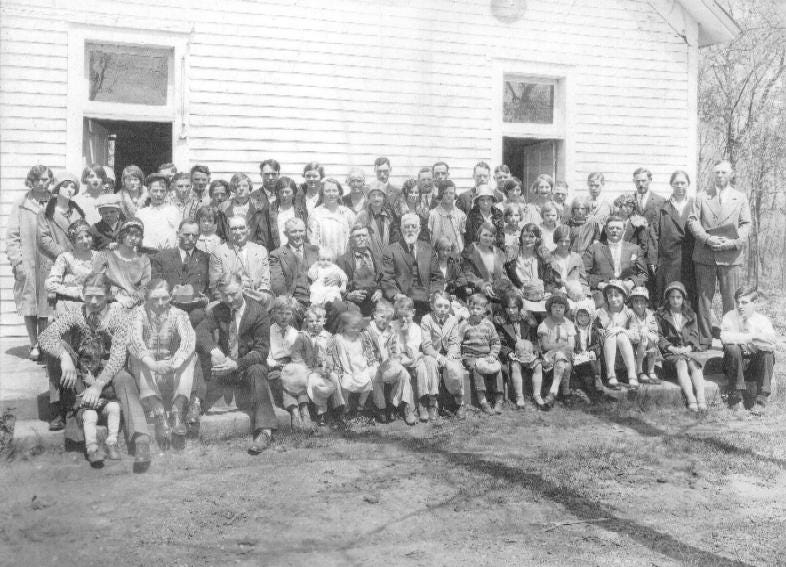 The congregation at a meeting in 1928. The church has thenames of most ...