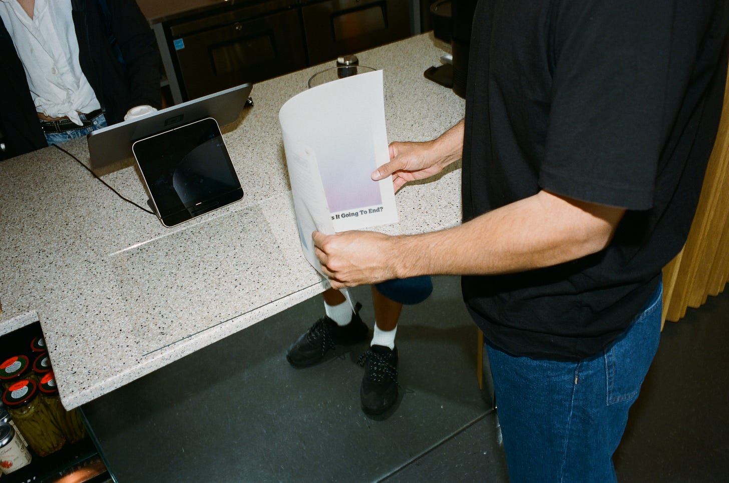Matthew Chavarria removes the menu from its glass case