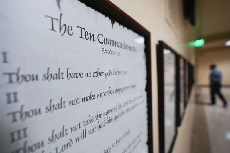 A copy of the Ten Commandments is posted along with other historical documents in a hallway at the Georgia State Capitol Building Thursday, June 20, 2024, in Atlanta. Louisiana has become the first state in the country to require the Ten Commandments are displayed in all public schools. (AP Photo/John Bazemore)