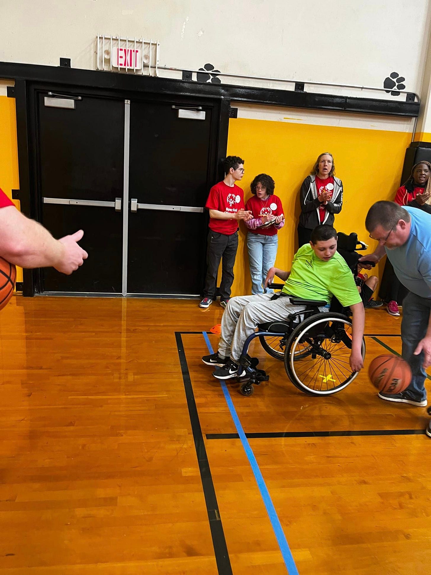 May be an image of 6 people and people playing basketball