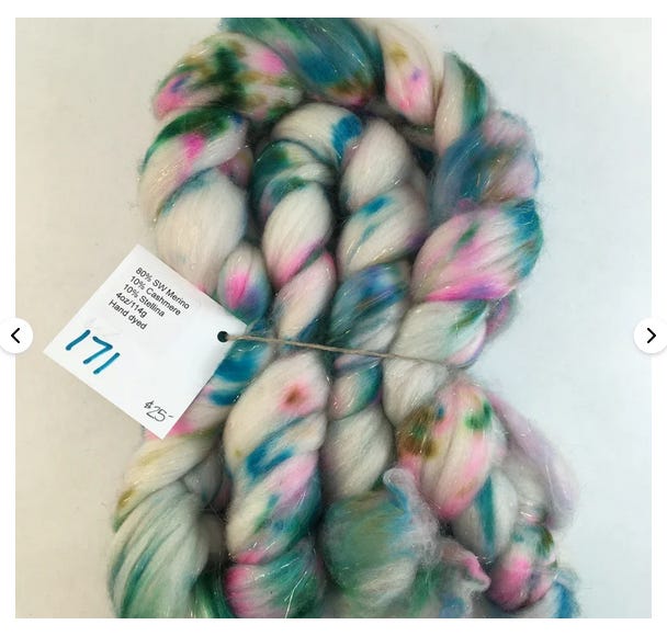 Superwash Merino kid mohair stellina blended together and dyed with splotches of blue sea green and pink