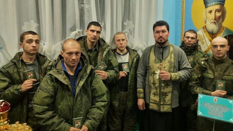 ’Storm V’ fighters at a christening ceremony in December 2023. The BBC has identified several of those in the photograph to be convicts from Chelyabinsk region.