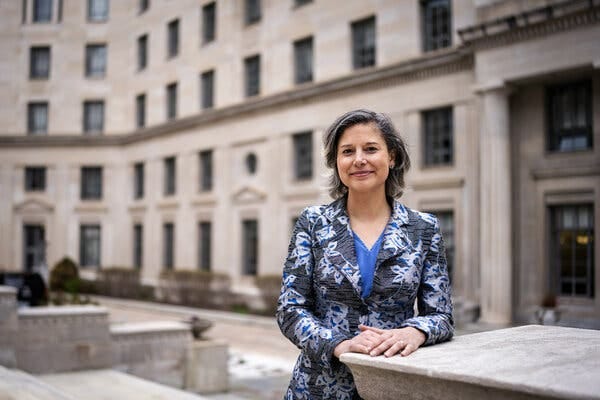 Maggie Goodlander stands facing the camera outside the Justice Department in Washington. 