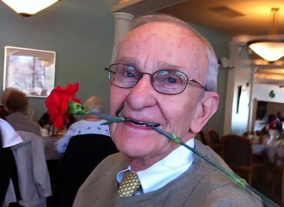 Photo of my father with a rose in his mouth