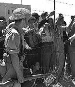 File:Israeli soldier and Palestinian prisoners in Ramle 1948.jpg