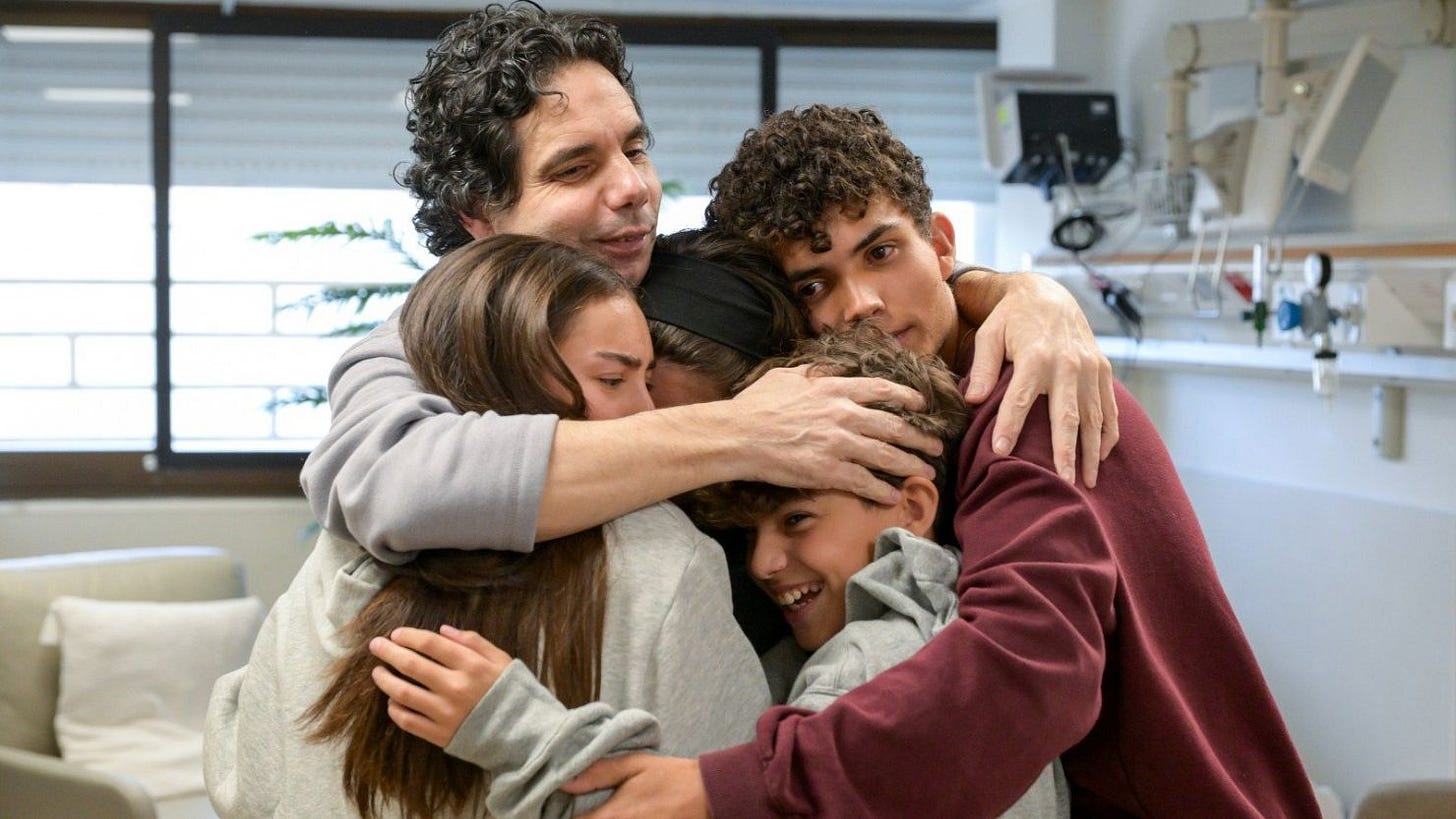 Ofer Kalderon embraced his children at Sheba Hospital near Tel Aviv on Saturday. Ofer Kalderon embraced his children at Sheba Hospital near Tel Aviv on Saturday.
