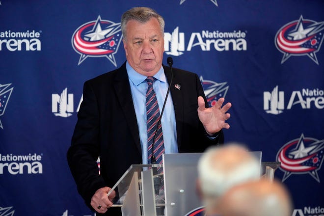 Don Waddell speaks at a press conference for the Columbus Blue Jackets.