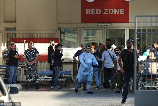 People gather outside a hospital, as more than 1,000 people, including Hezbollah fighters and medics, were wounded on Tuesday when the pagers they use to communicate exploded across Lebanon, according to a security source, in Beirut, Lebanon September 17, 2024