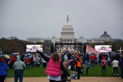 People attend a "Let Us Worship" tour concert by Christian musician Sean Feucht on the National Mall in Washington, Sunday, Oct. 25, 2020. RNS photo by Jack Jenkins