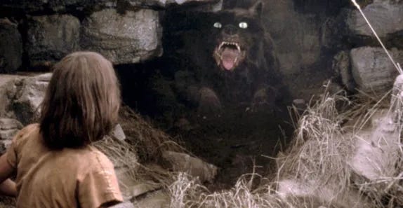 image from The Neverending Story of Atreyu facing Gmork, the Nothing, a dark demon