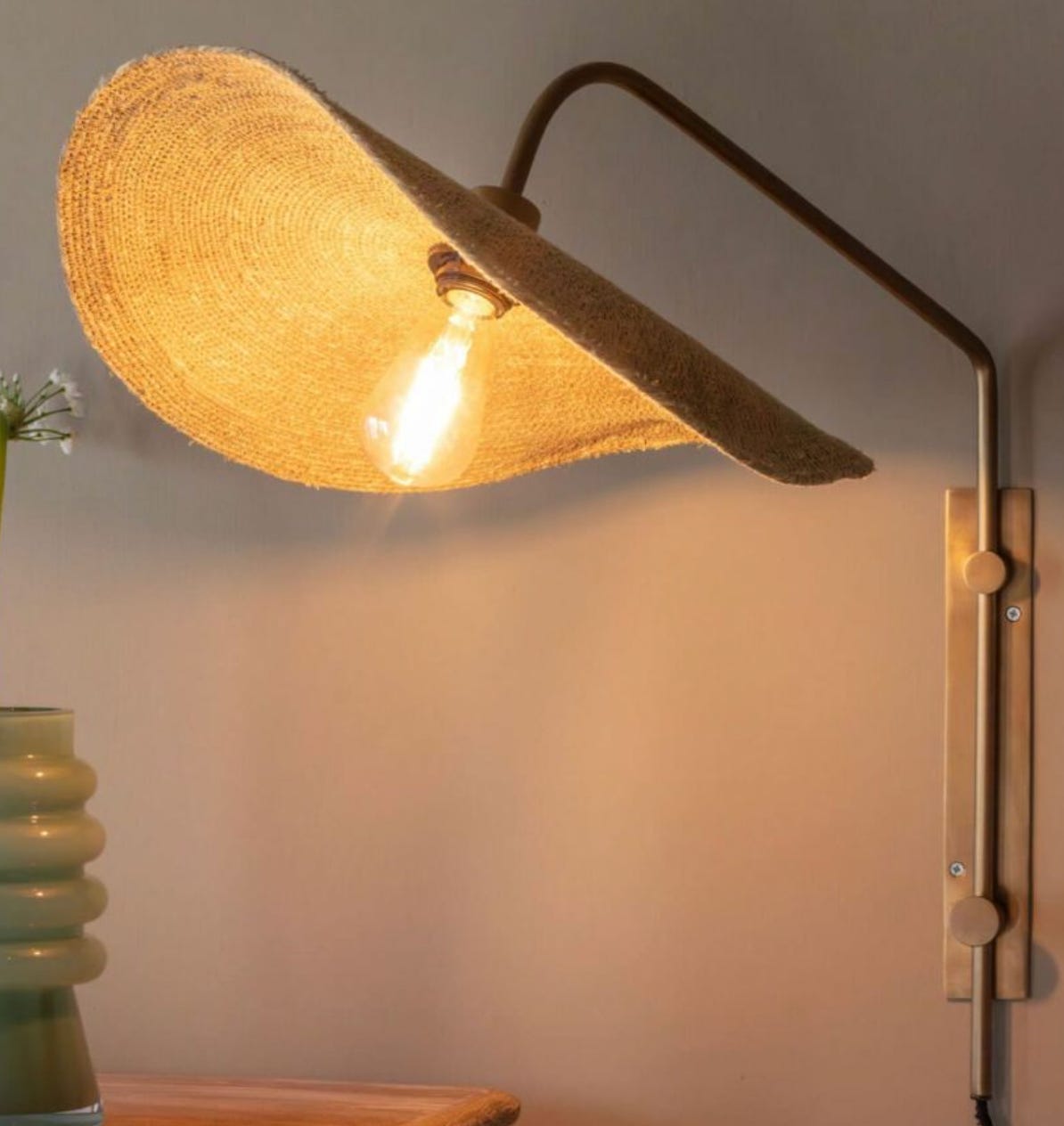 wall light with a floppy hat inspired lampshade