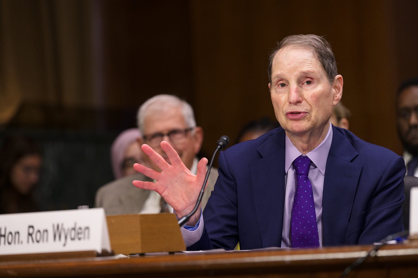 May be an image of 4 people and text that says 'Hon. Ron Wyden'
