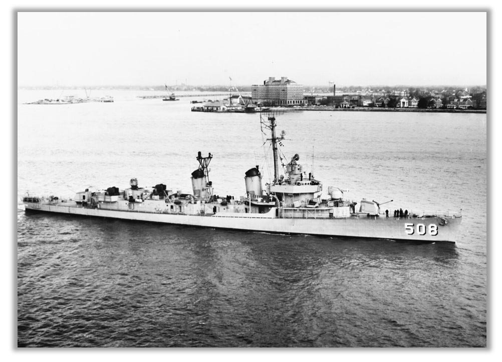 USS Cony is shown floating in a harbor.