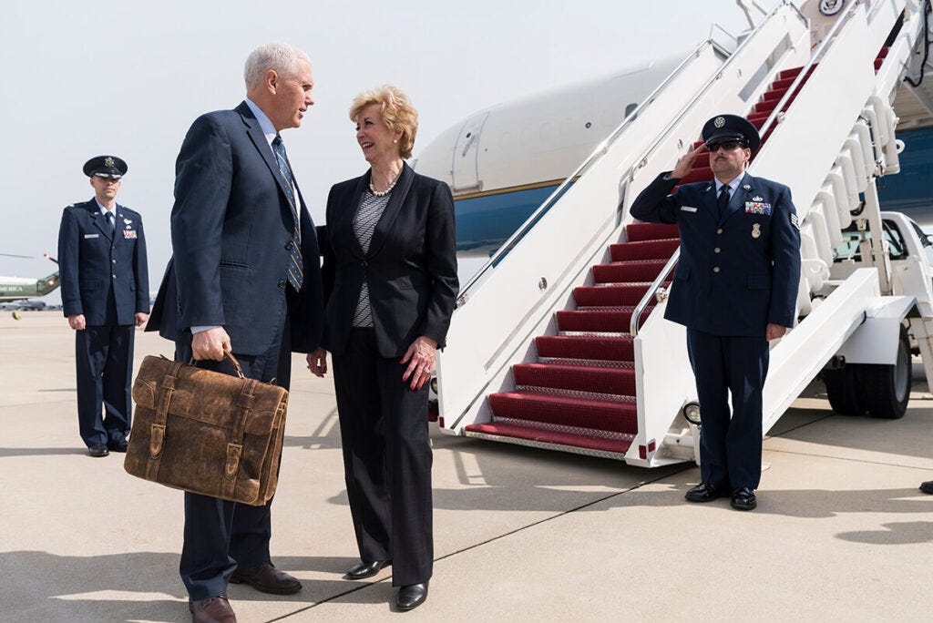 "Vice President Mike Pence meets with U.S. Small Business Administration Administrator Linda McMahon as they prepare to board Air Force Two at Joint Base Andrews, Maryland, en route to Yeager Airport, Charlestown, West Virginia, Saturday, March 25, 2017, for a meeting with small business owners. (Official White House Photo by Myles Cullen)" under public domain by The White House